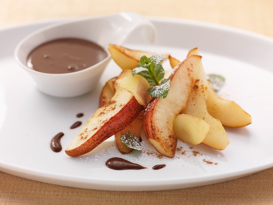Pear wedges with chocolate sauce