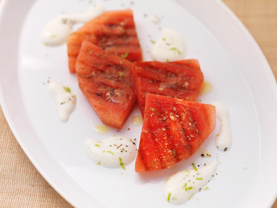 Barbecued watermelon slices with a lime sauce