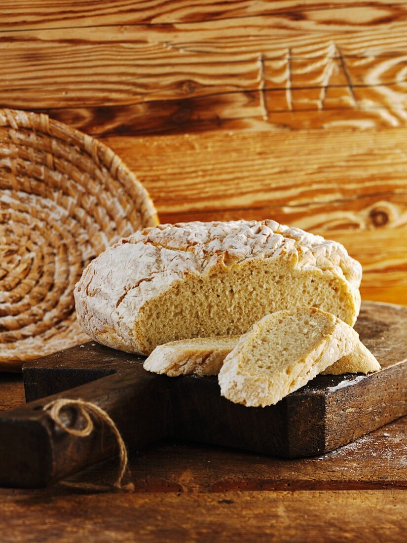 Rustic French bread, partly sliced