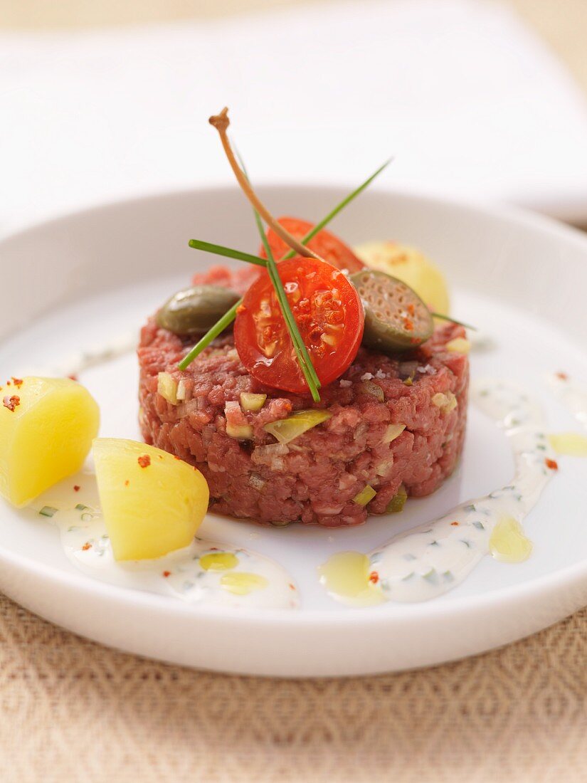 Steak tartare with cherry tomatoes and giant capers