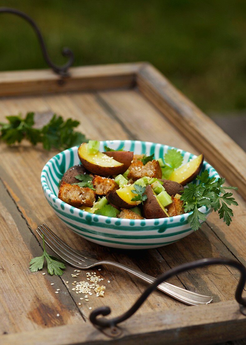 Smoked potato and bread salad with celery