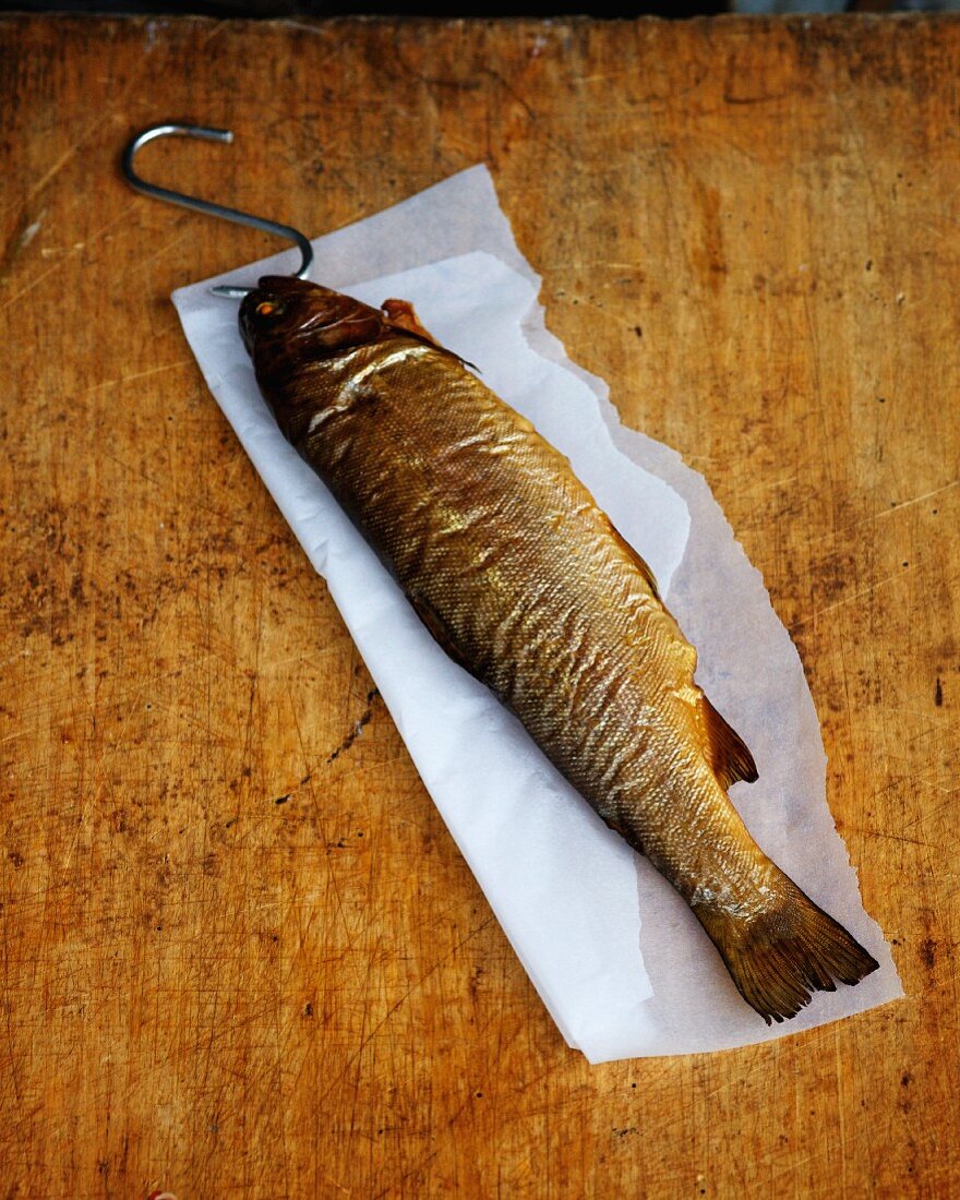 Smoked trout on a sheet of paper
