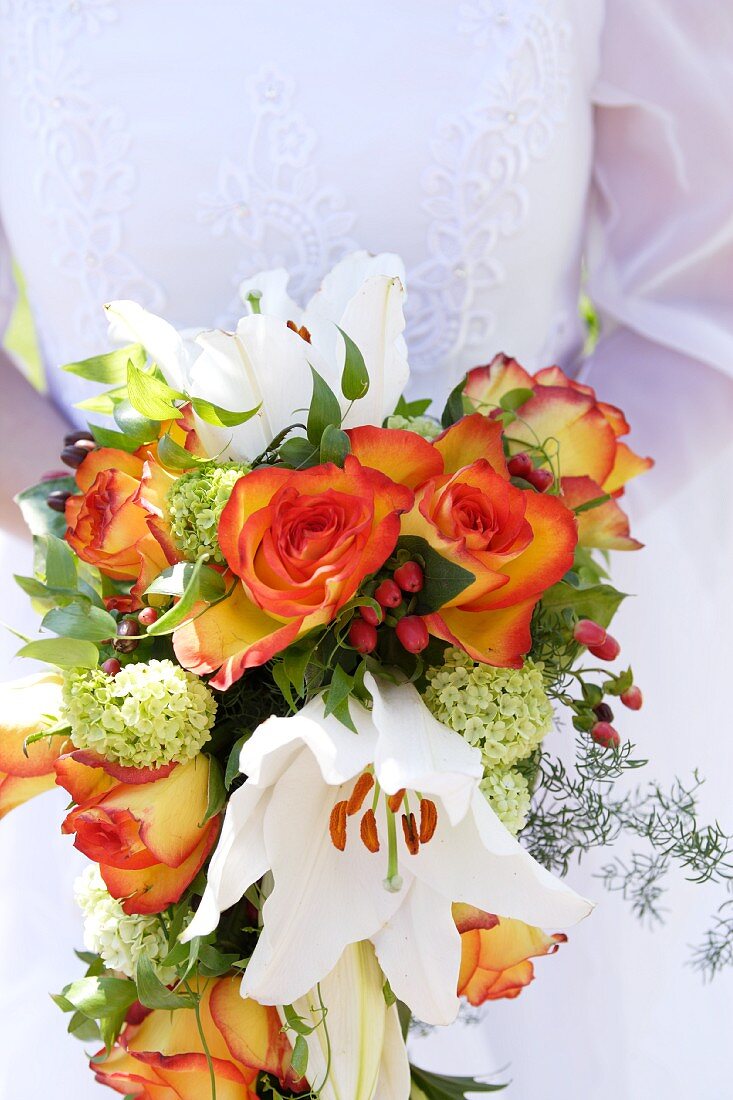 Bridal bouquet with roses and lilies