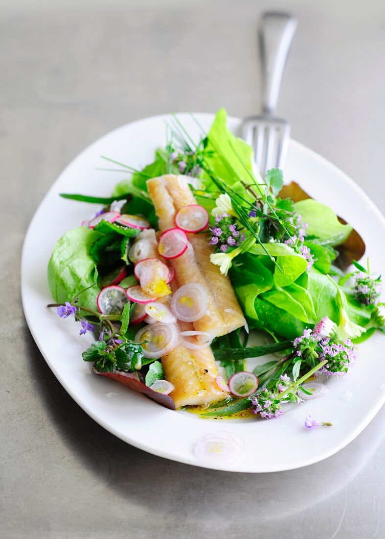 Colourful salad with smoked eel and edible flowers