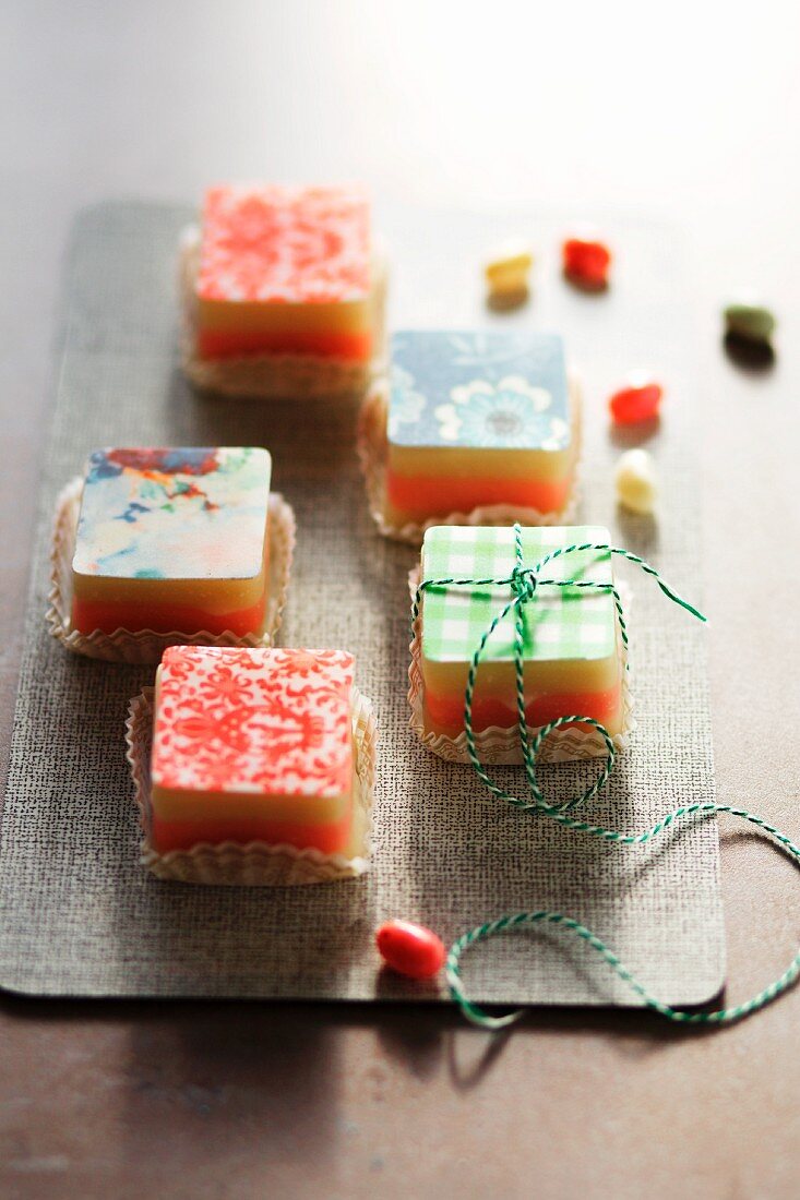 Petits fours topped with patterned sugar glaze