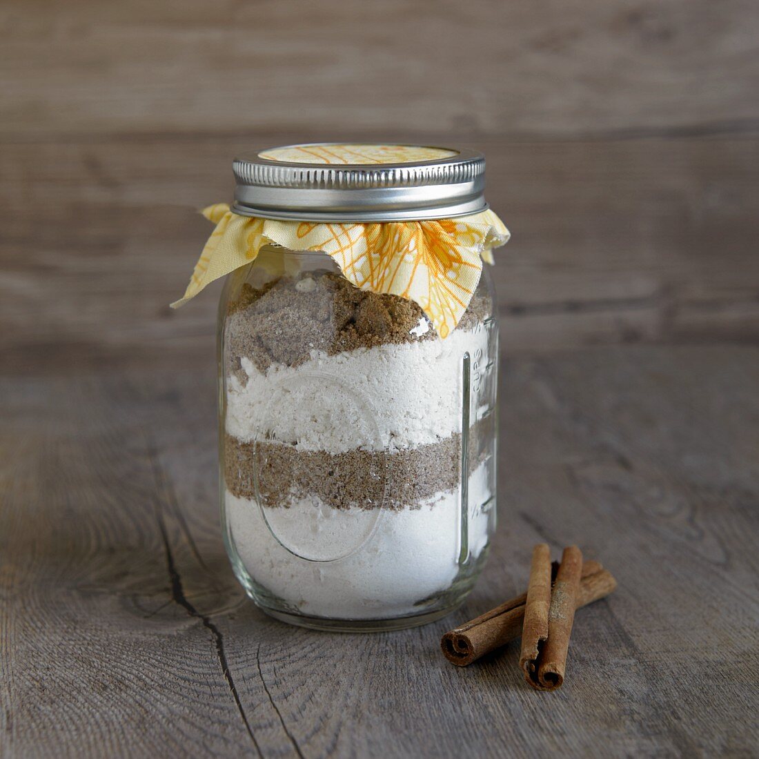 A jar containing dry ingredients for making cinnamon bread