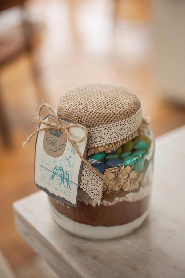 Dry ingredients for making mocha and oat biscuits, in a jar as a gift