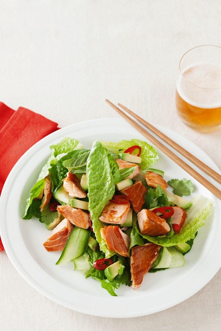 Asian-style salad with crispy salmon pieces