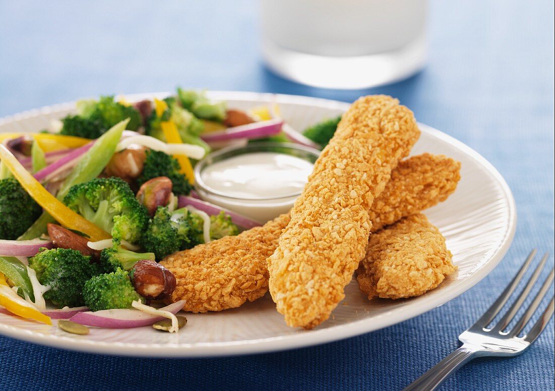 Crispy chicken goujons with a broccoli side dish