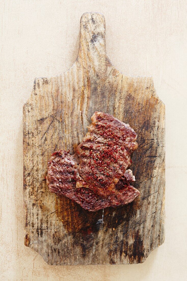 Raw spiced beef on a chopping board