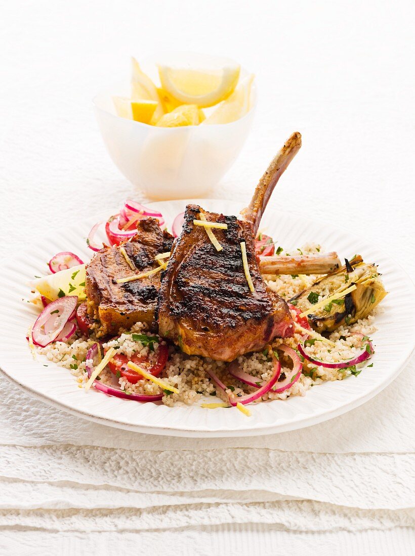 Spicy lamb chops with harissa on a bed of couscous