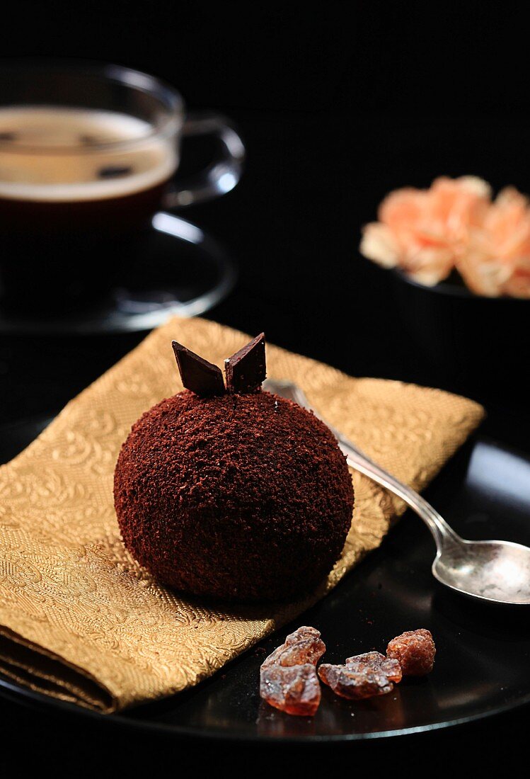 A chocolate ball and a cup of coffee
