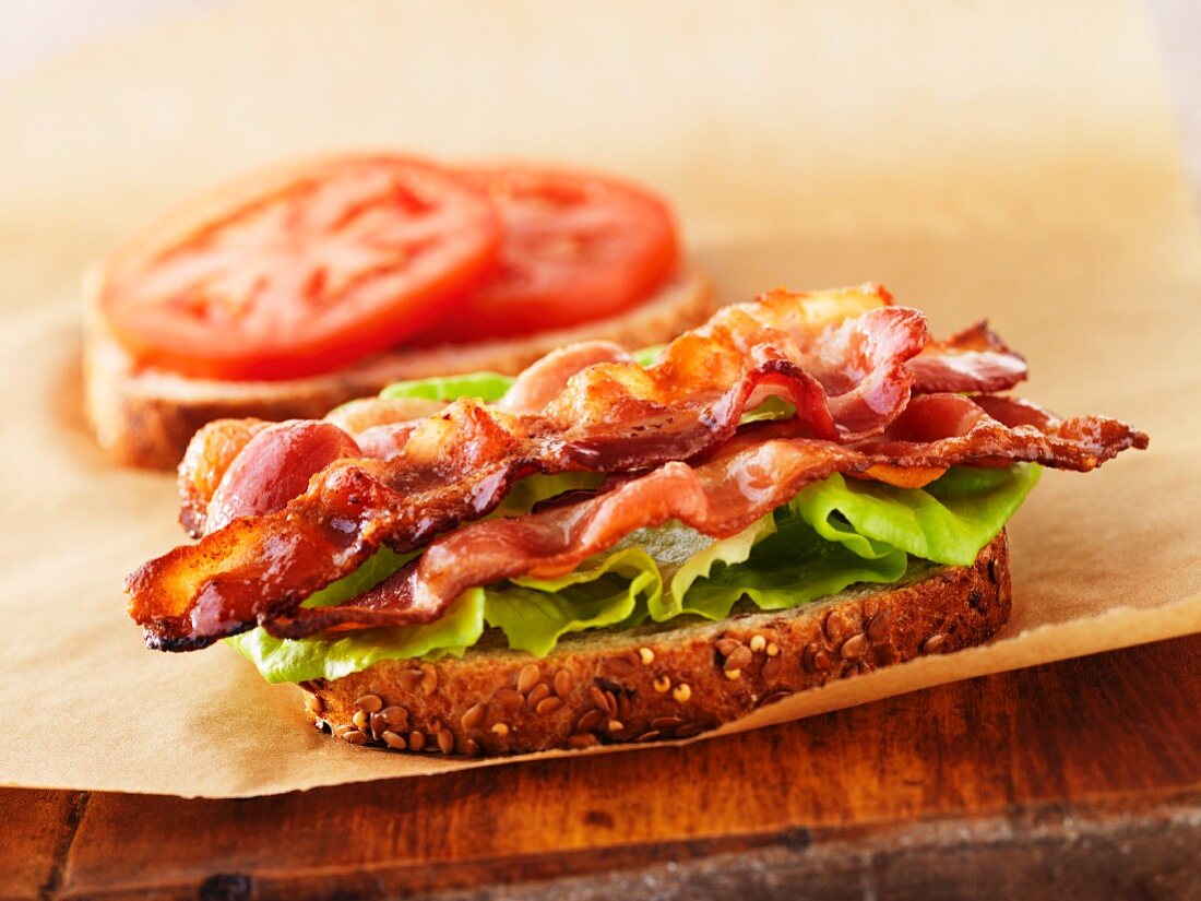 A BLT sandwich - filled with bacon, lettuce and tomato