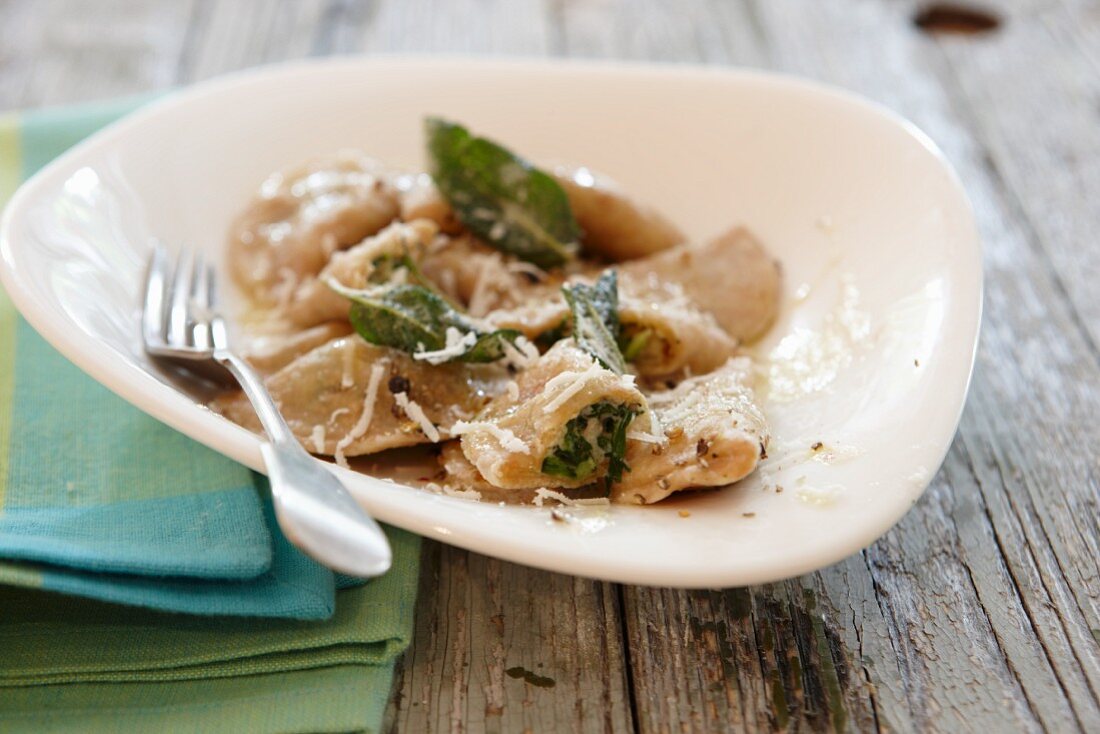 Ravioli with sage and grated cheese