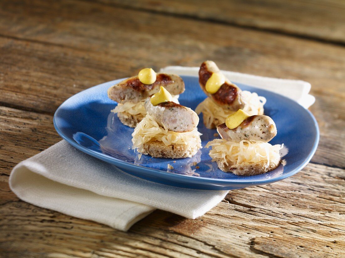 Bavarian canapés of sauerkraut, grilled bratwurst and mustard