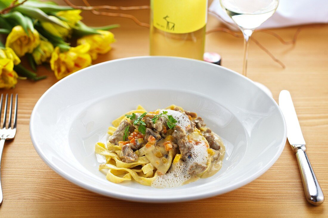 Goat ragout in a verjuice and cream sauce on a bed of home-made pasta