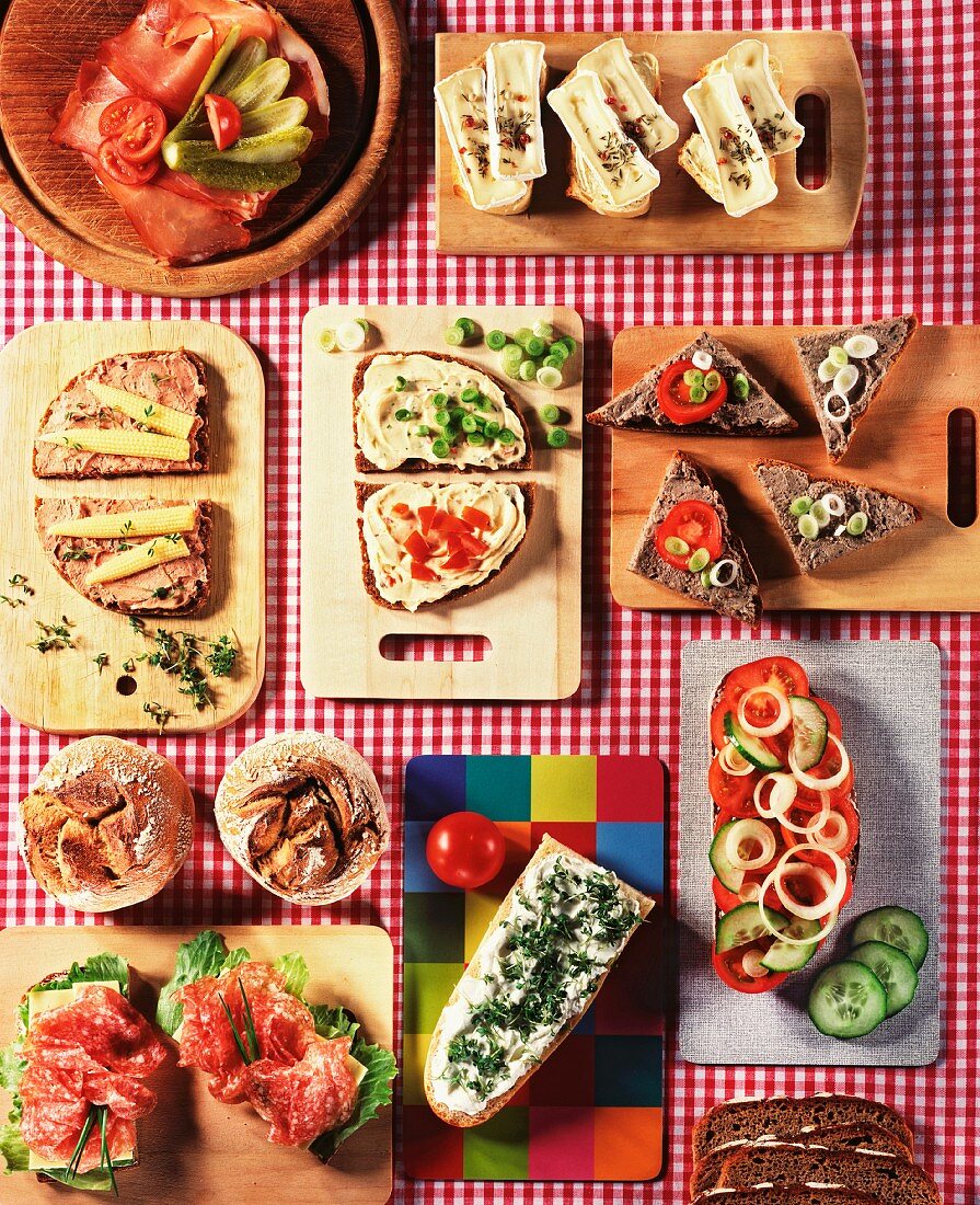 Slices of bread with various toppings on small boards