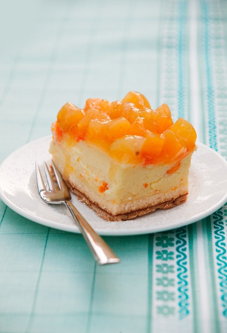 A piece of apricot cheesecake