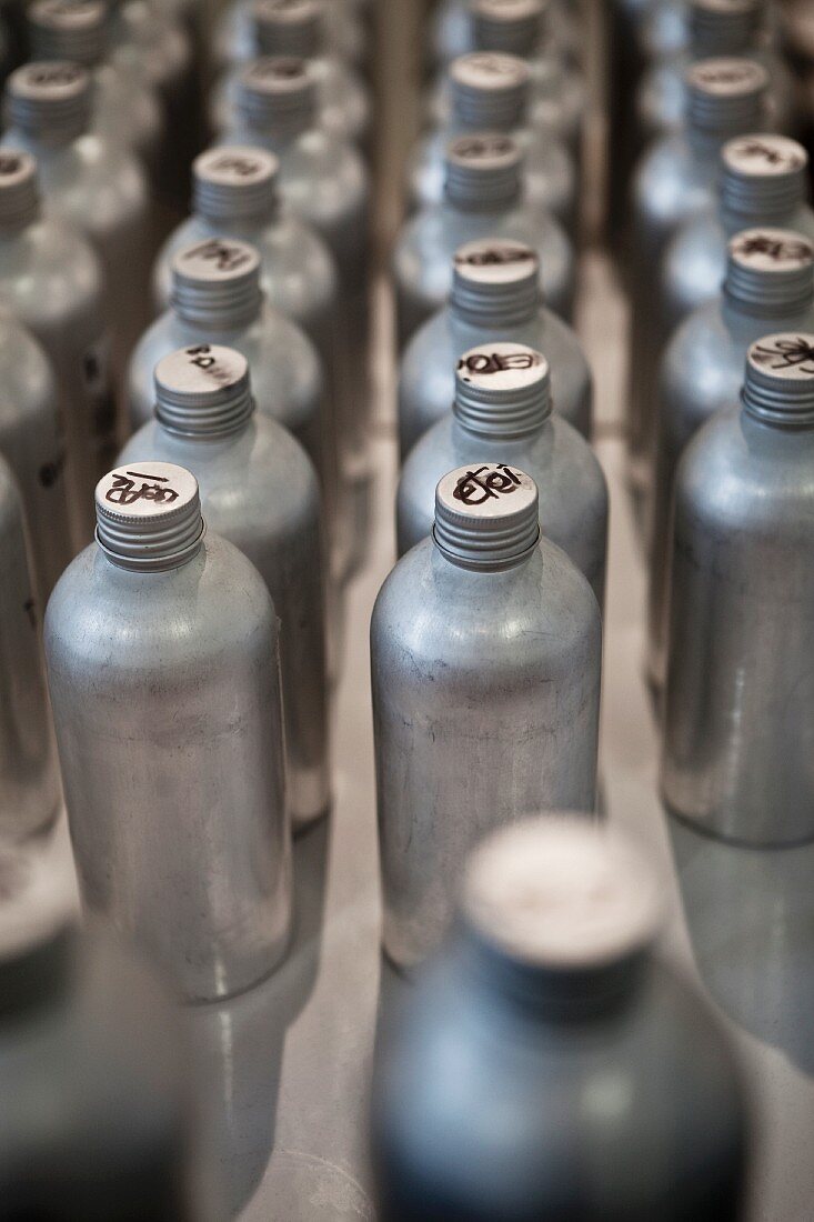 Rows of Metal Bottles with French Writing