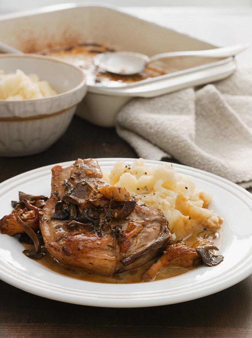 Pork chop with mashed potato and mushrooms