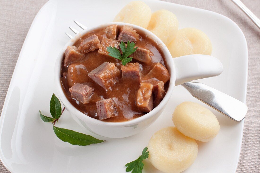 Goulash of goose with potato dumplings