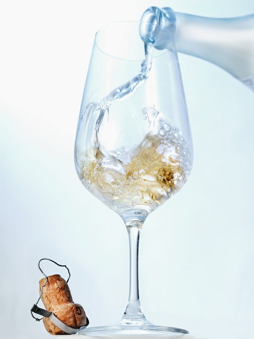 Prosecco being poured into a glass