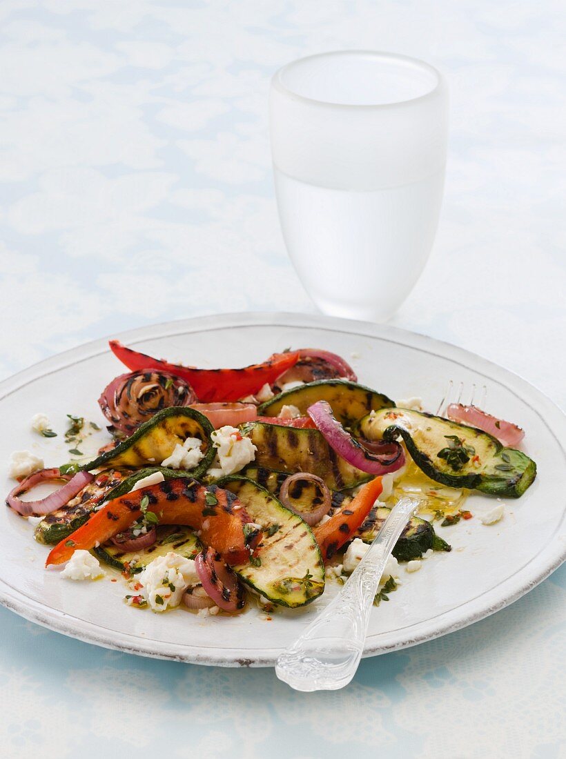 A plate of grilled vegetables with feta