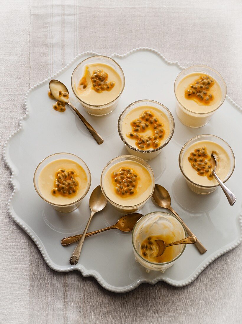 White chocolate puddings with passion fruit sauce