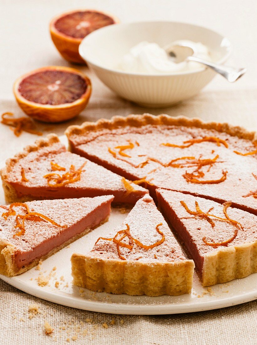 Blood orange tart with icing sugar