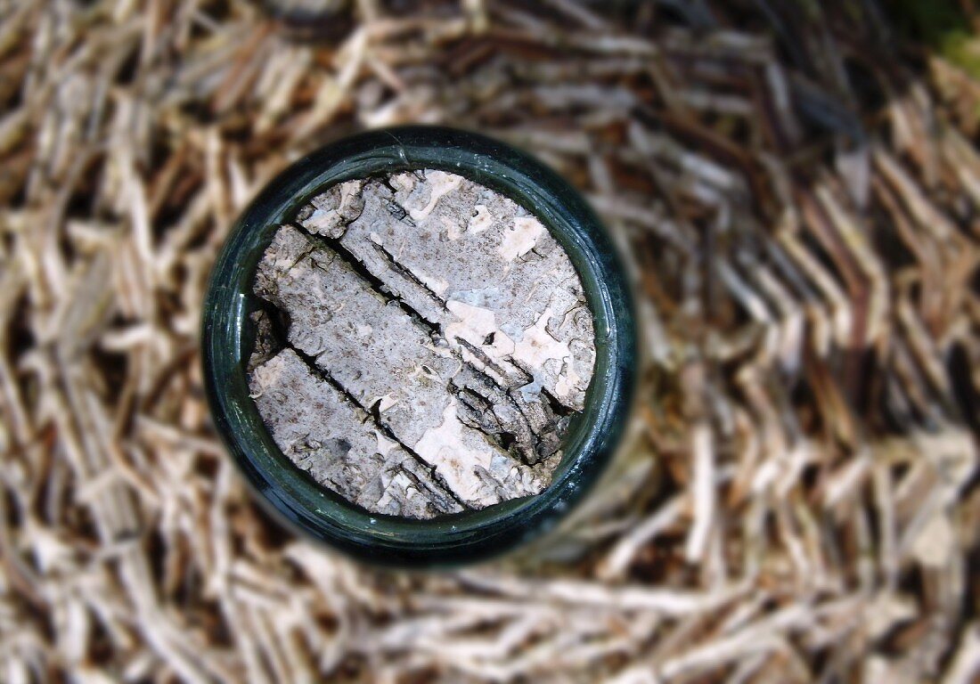 A cork in a wicker bottle