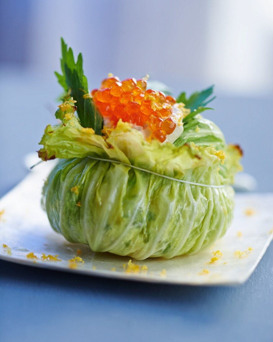 A cabbage leaf filled with smoked fish and trout caviar