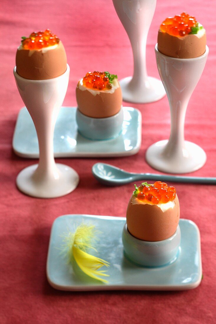 Soft-boiled eggs with caviar in eggcups