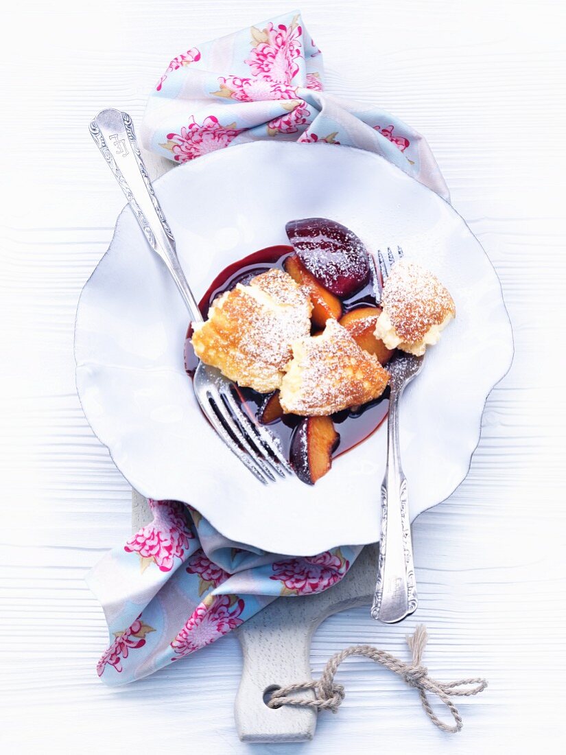 Mascarpone pancake pieces with stewed plums