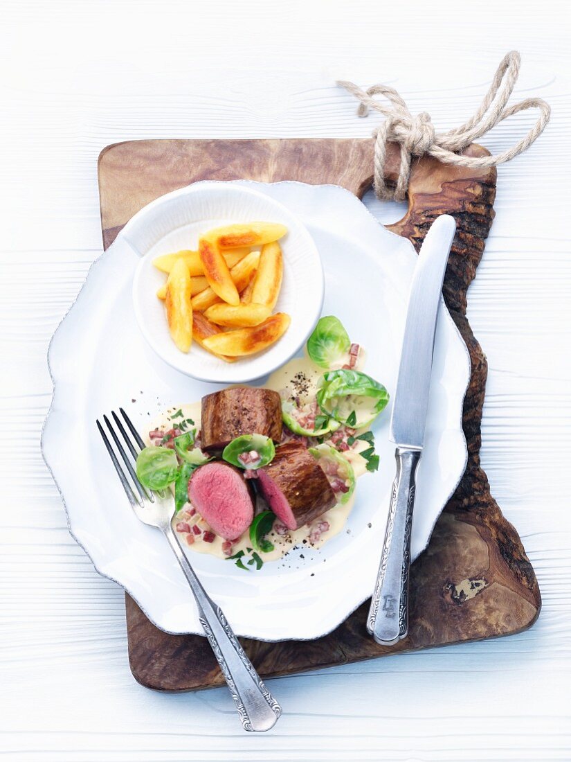 Saddle of venison with Brussels sprout leaves and potato orzo pasta