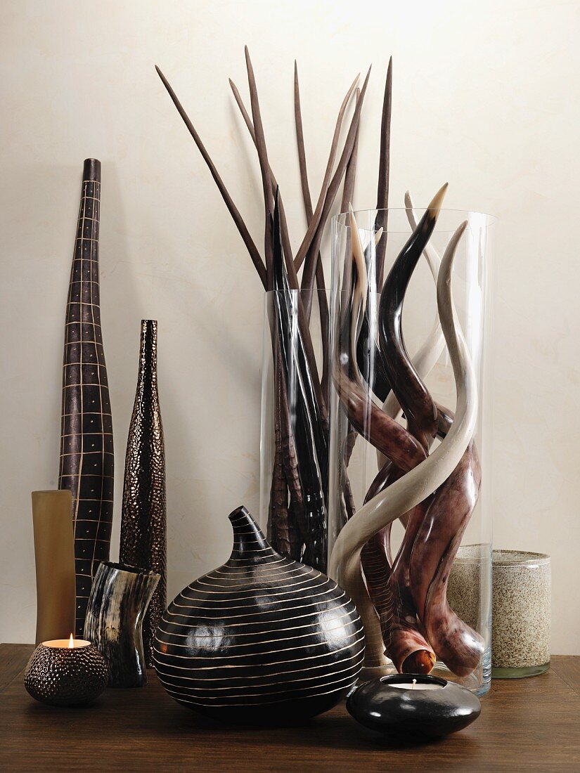 Vases and tea light holders in shades of brown and glass vases with horns