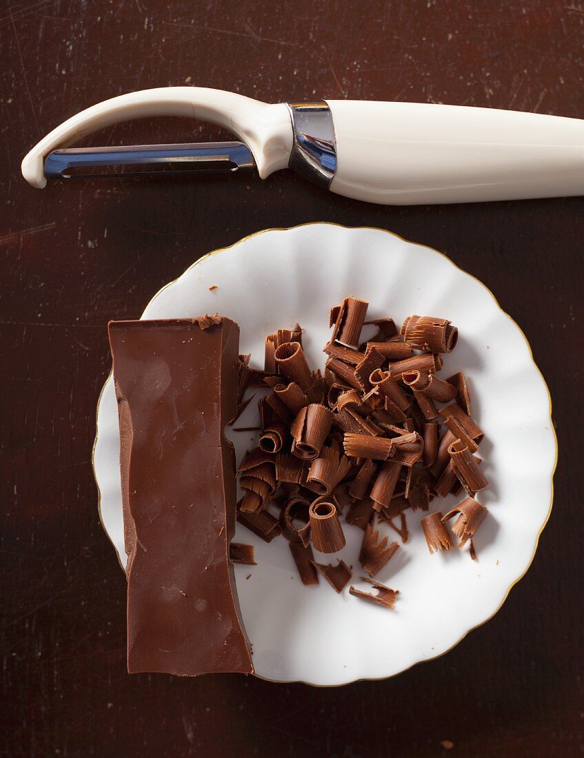 Chocolate curls being created with a peeler