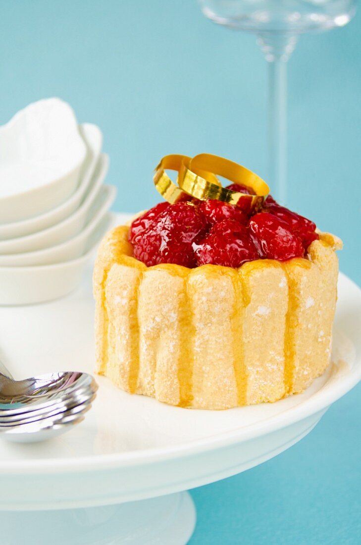 Raspberry charlotte on a cake stand