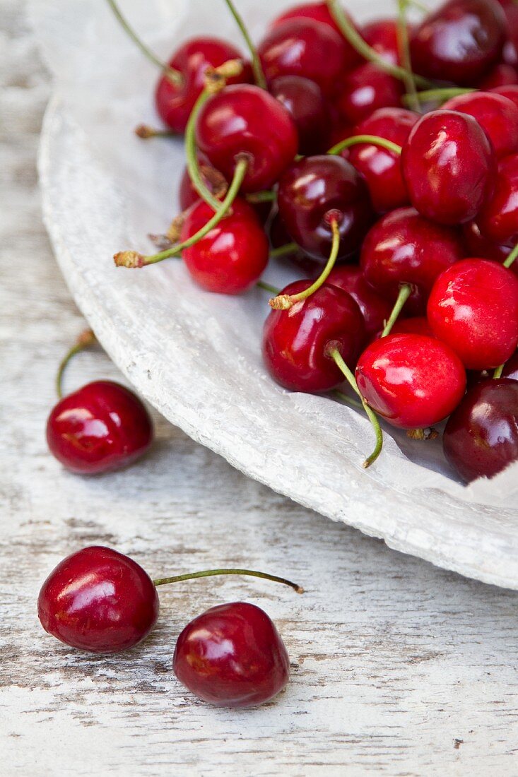 Fresh cherries on a stone plate