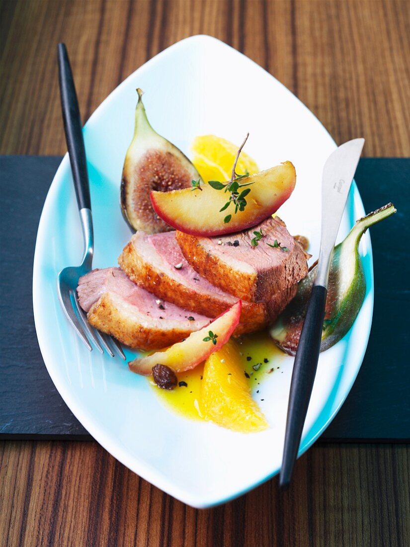 Duck breast with fruit and an orange sauce
