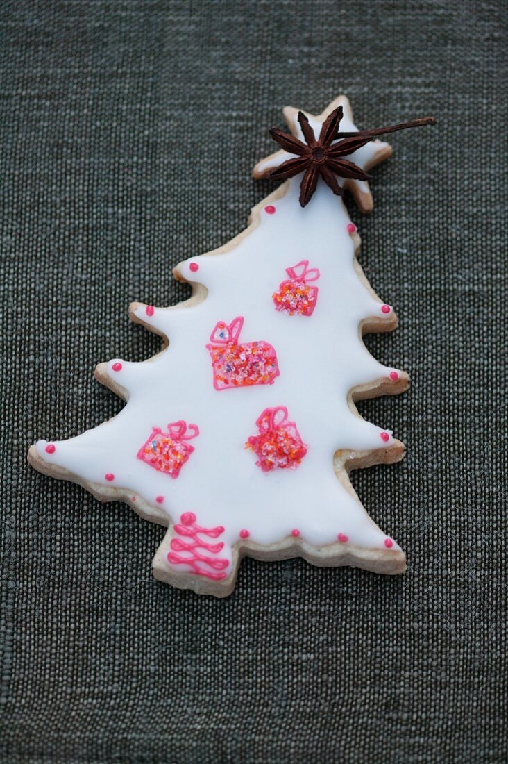 A decorated biscuit in the shape of a Christmas tree
