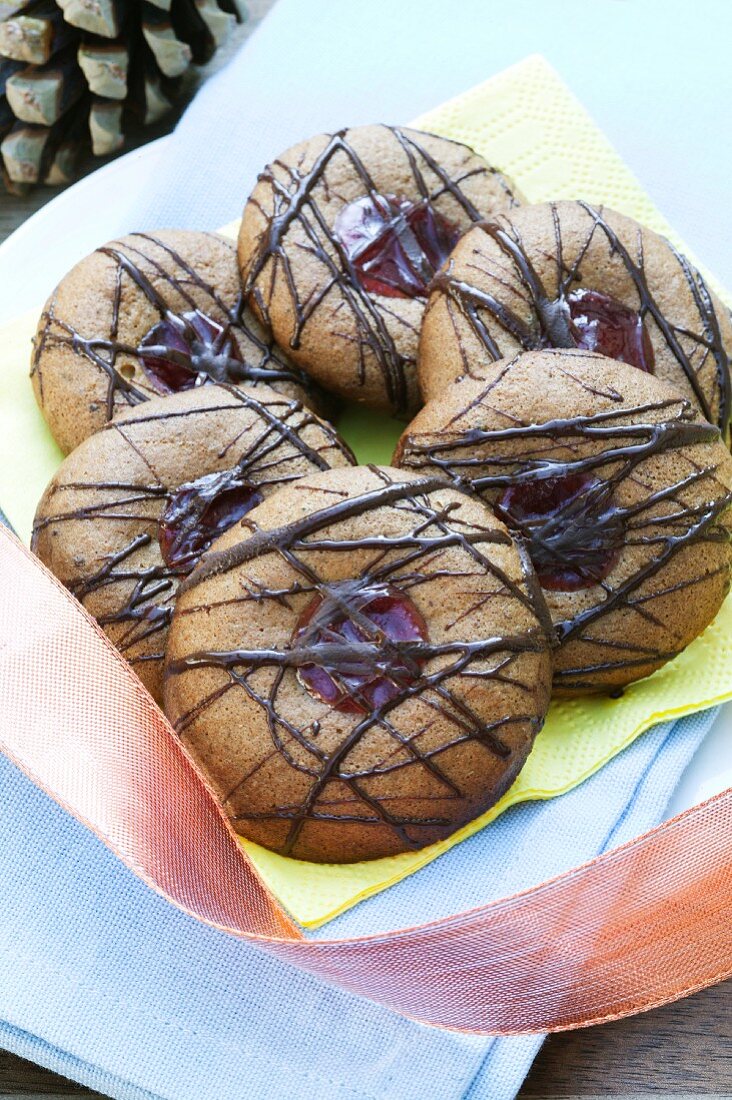 Soft honey biscuits with raspberry jam and chocolate glaze