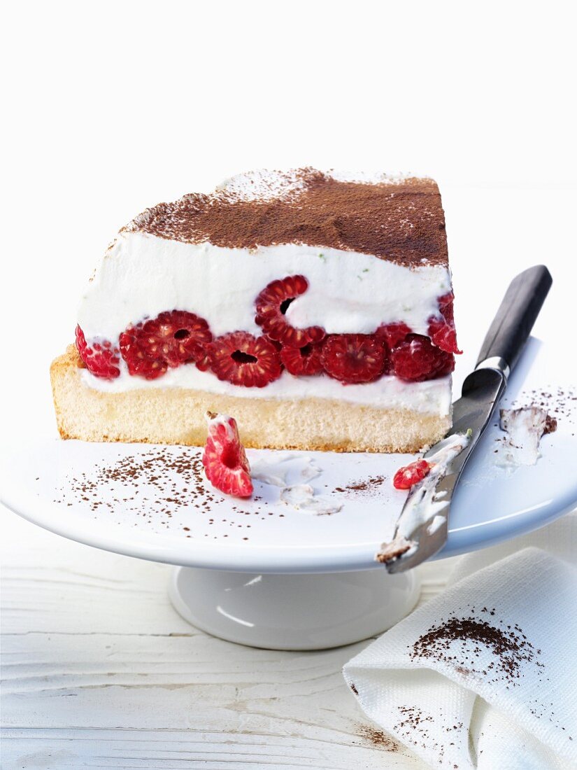 Tiramisu layer cake with raspberries
