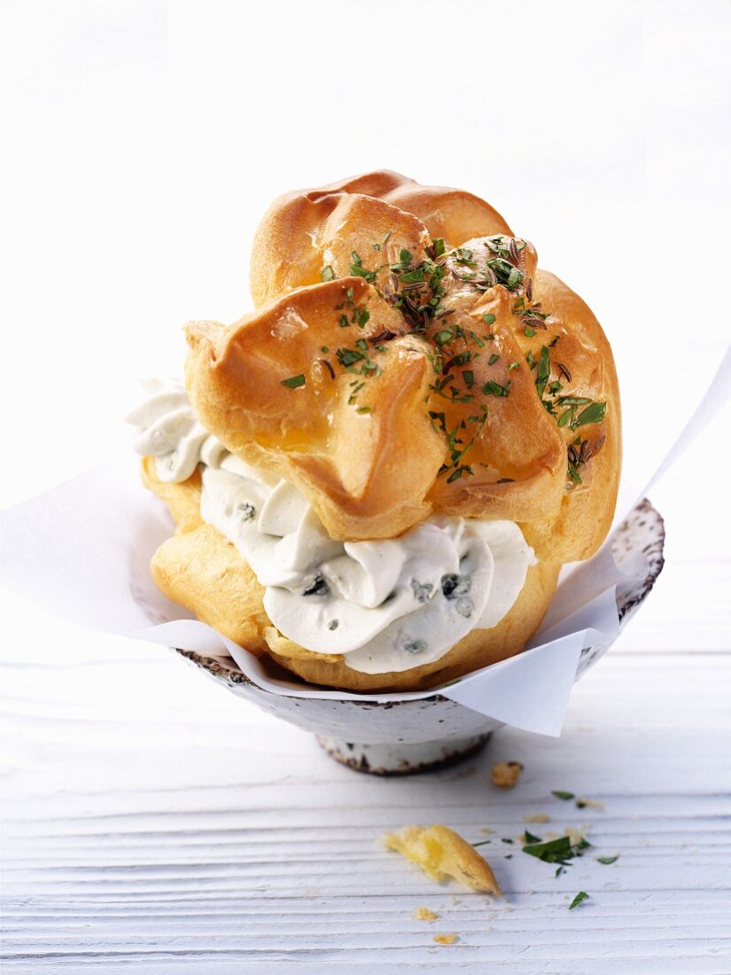 Profiterole filled with herb cream