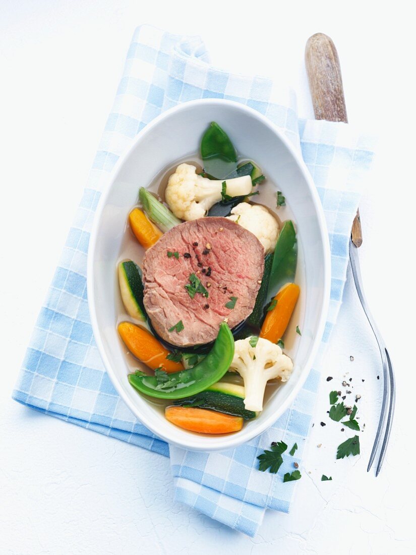 Poached fillet of beef with vegetables