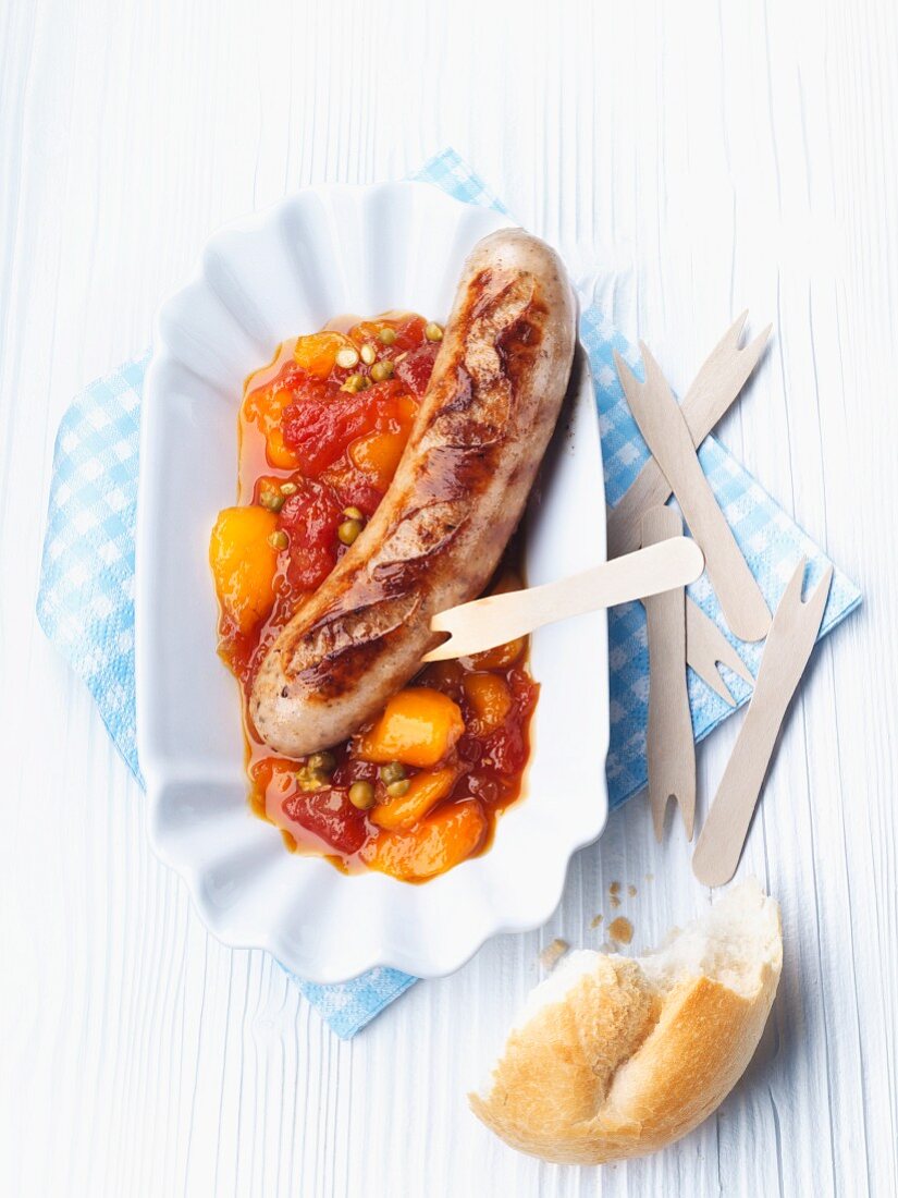 Grilled sausage with tomato and mango sauce