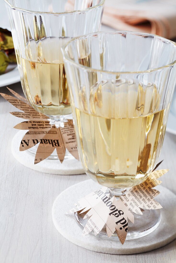 Wine glasses with newspaper drip collars