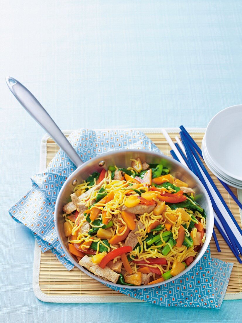 Egg noodles with pork, vegetables and pineapple