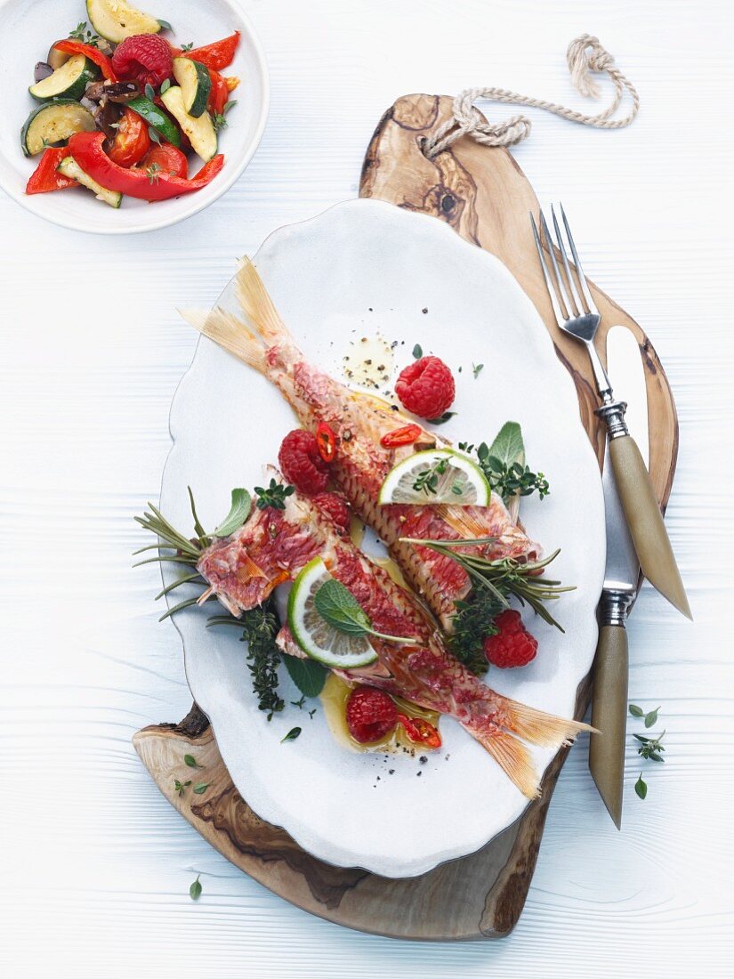 Red mullet with fresh raspberries, herbs and chilies