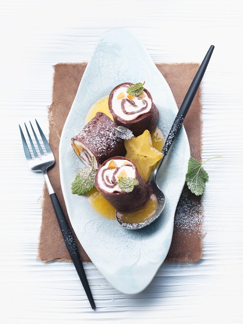 Chocolate pancakes with apricot & quark filling and star fruit
