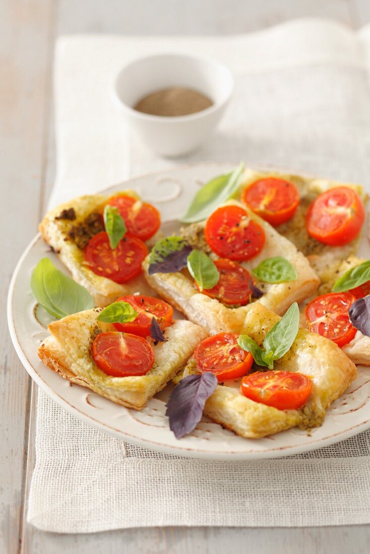Phyllo dough pizza with cherry tomatoes, mozzarella and basil